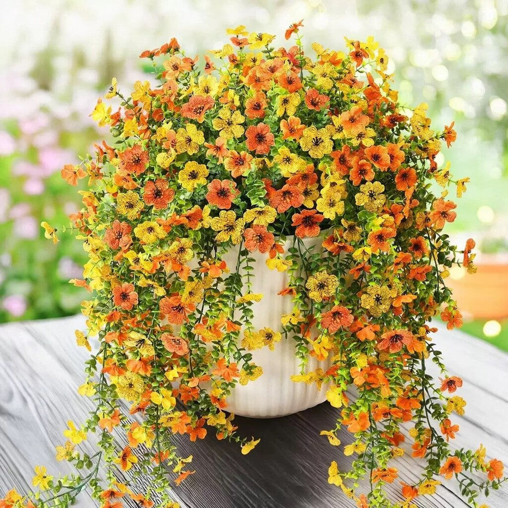 Kaskadenförmig angeordnete Gänseblümchen und Eukalyptusblüten für den Außenbereich – UV-beständig